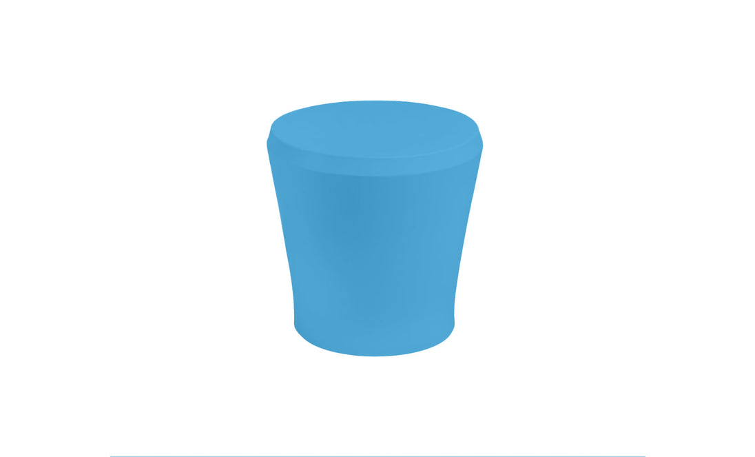 Against a plain white backdrop, the Ledge Lounger Affinity Side Table, a chic blue cylindrical stool with a smooth tapering design, is ideal for outdoor spaces and versatile enough for in-pool use.