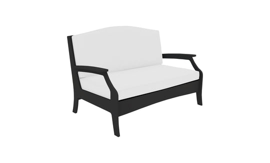 Meet the Legacy Loveseat by Ledge Lounger: a white cushioned masterpiece with a sleek black frame, curved armrests, and high backrest. Its modern, minimalist design enhances any indoor or outdoor space.