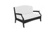Meet the Legacy Loveseat by Ledge Lounger: a white cushioned masterpiece with a sleek black frame, curved armrests, and high backrest. Its modern, minimalist design enhances any indoor or outdoor space.