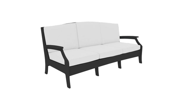 The Legacy Sofa by Ledge Lounger, a three-seater with a sleek black frame and white cushions, merges traditional deep seat comfort with modern design. Its minimalist armrests and durable outdoor fabrics offer elegance and longevity.