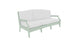A Legacy Sofa from Ledge Lounger in light green with white cushions is set against a plain white background. The sofa has a modern design with armrests and three cushion sections, made in outdoor fabrics for lasting style and comfort.