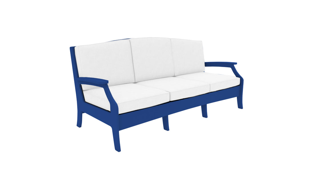 A Legacy Sofa by Ledge Lounger, crafted in blue wood with a traditional deep seat, features three white cushions and armrests. It is set against a plain white background.