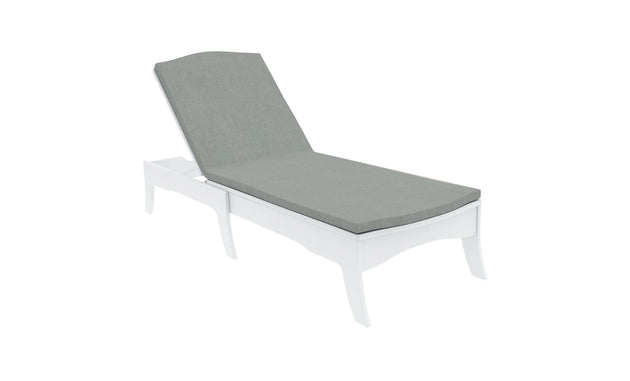 A white wooden lounge chair with a Legacy Chaise Cushion by Ledge Lounger features a reclining backrest. Its showcased against a white background, highlighting its modern design and durable gray outdoor fabric, perfect for customization.