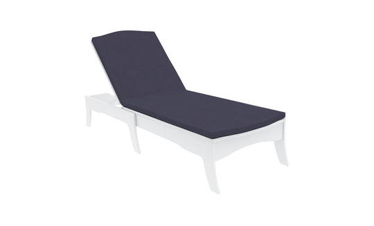 The sleek outdoor chaise lounge, set against a pristine white backdrop, showcases a dark Legacy Chaise Cushion by Ledge Lounger. Its modern design features curved legs and an adjustable backrest, with customization using premium outdoor fabric for enduring comfort and elegance.