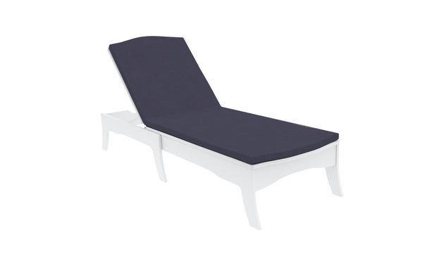 The sleek outdoor chaise lounge, set against a pristine white backdrop, showcases a dark Legacy Chaise Cushion by Ledge Lounger. Its modern design features curved legs and an adjustable backrest, with customization using premium outdoor fabric for enduring comfort and elegance.