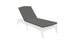 A sleek, minimalist outdoor chaise lounge features a white frame and dark gray Legacy Chaise Cushion by Ledge Lounger. The adjustable backrest and durable outdoor fabric make it perfect for the patio or poolside. The background is plain white.