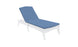 A white chaise lounge chair features a Legacy Chaise Cushion by Ledge Lounger in blue, displayed on a white background. The backrest is slightly elevated, highlighting its customizable outdoor fabric options.