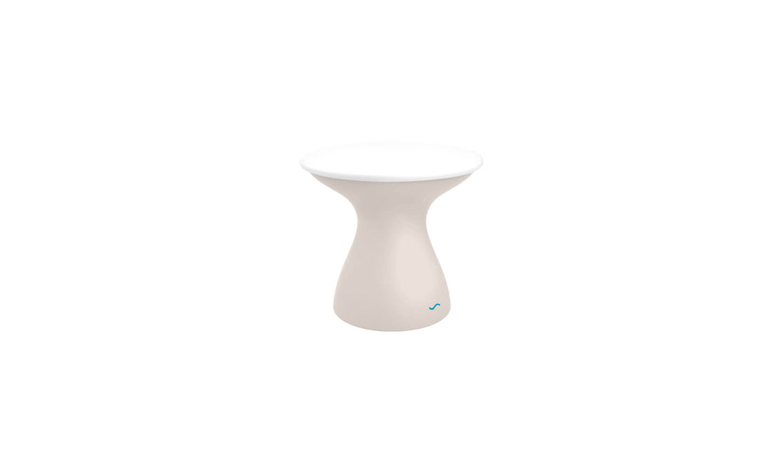 The Autograph Standard Side Table by Ledge Lounger, featuring an hourglass shape with a smooth surface and slightly flared base, is displayed on a white background.