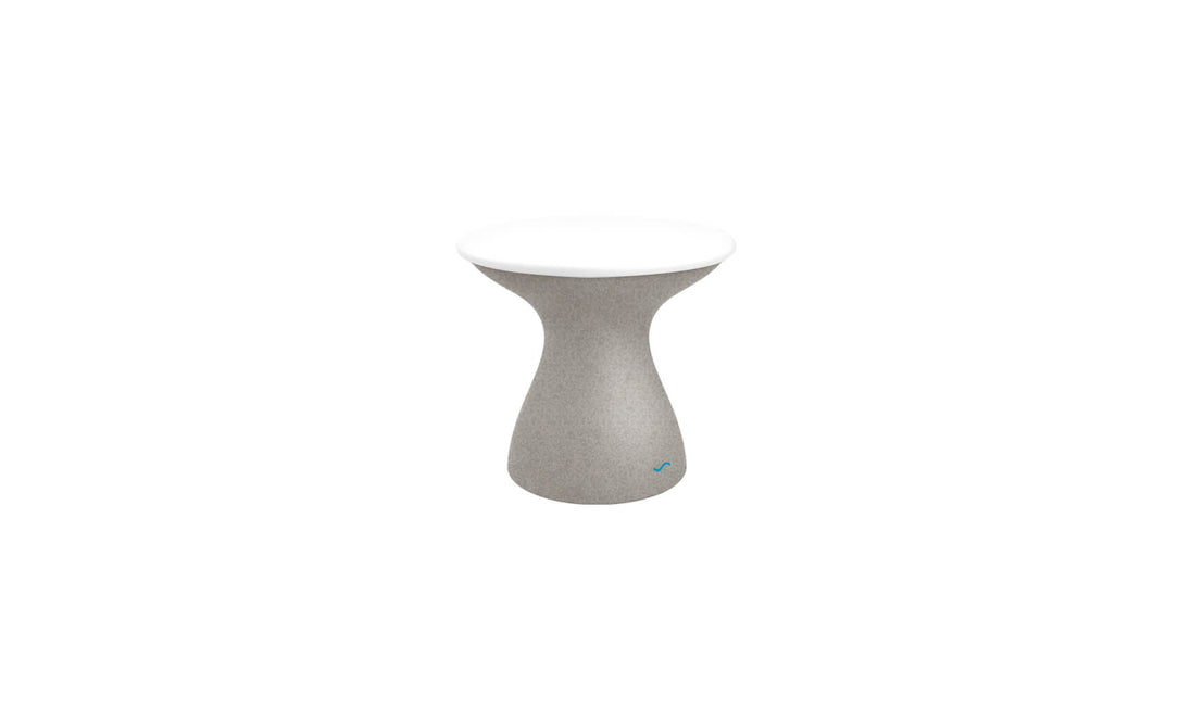 The Autograph Standard Side Table by Ledge Lounger is a small, modern outdoor side table with a sleek design, featuring a curved gray base and smooth white round top—ideal for stylish poolside storage.