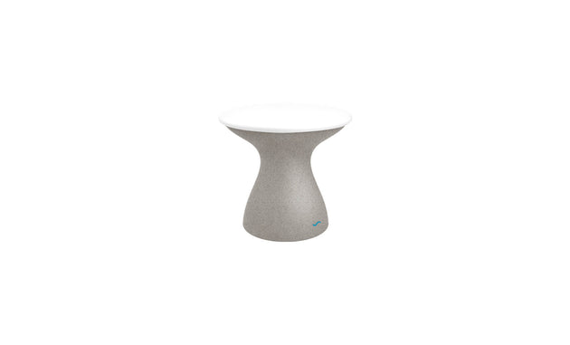 The Autograph Standard Side Table by Ledge Lounger is a small, modern outdoor side table with a sleek design, featuring a curved gray base and smooth white round top—ideal for stylish poolside storage.