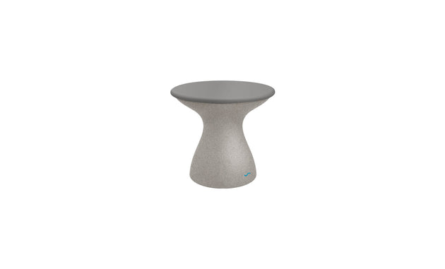 The Autograph Standard Side Table by Ledge Lounger features a small, modern round table with a sleek gray top and a smooth curved pedestal base. Its textured gray base complements the tabletop, making it perfect for stylish poolside storage.