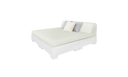 The Affinity Square Sunbed with Backrest Cushion by Ledge Lounger features a minimalist design, white base, light green mattress, simple headboard, and three pillows—two light-colored and one darker—perfect for creating an inviting poolside space.