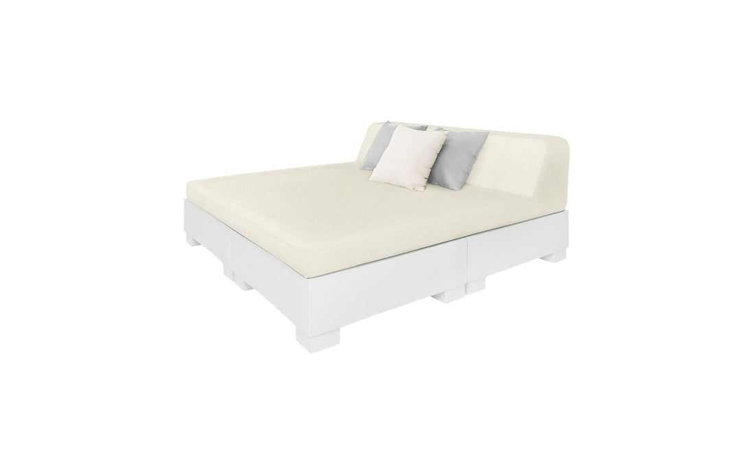 The Affinity Square Sunbed with Backrest Cushion by Ledge Lounger features a modern white minimalist design, ideal for indoor elegance or poolside relaxation. Its simple headboard comes with two decorative pillows in white and gray, enhancing any peaceful outdoor setting.