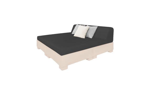 The Affinity Square Sunbed by Ledge Lounger features a minimalist pallet-style design with a beige frame and black mattress. Ideal for poolside relaxation, it includes a backrest cushion and three additional cushions—two gray, one white—set against a crisp white background.