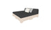 The Affinity Square Sunbed by Ledge Lounger features a minimalist pallet-style design with a beige frame and black mattress. Ideal for poolside relaxation, it includes a backrest cushion and three additional cushions—two gray, one white—set against a crisp white background.