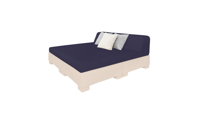 The Affinity Square Sunbed by Ledge Lounger features a minimalist design with a navy blue mattress on a light beige base. It includes two back cushions—one white, one light gray—ideal for poolside relaxation against a plain white backdrop. Perfect for enhancing any outdoor space.