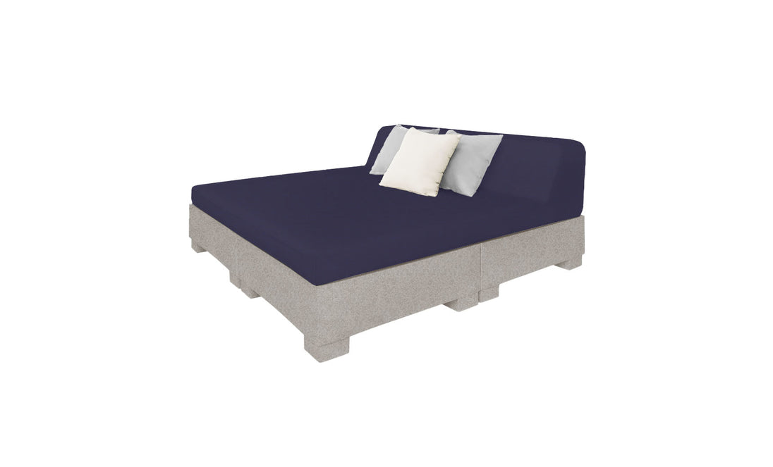 The Ledge Lounger Affinity Square Sunbed with Backrest Cushion features a minimalist, rustic design with a dark blue mattress and two light-colored pillows, one white and one grey, crafted from wood pallets. Its ideal for poolside relaxation or enhancing your outdoor space.