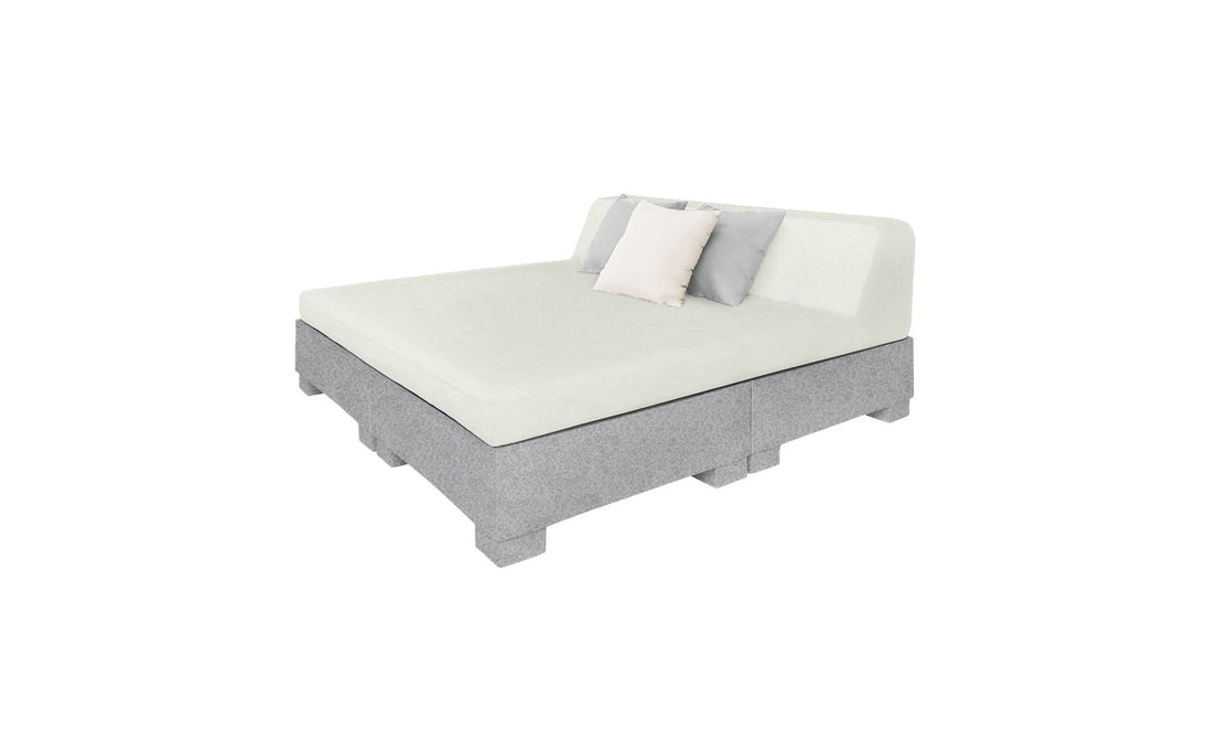 The Affinity Square Sunbed with Backrest Cushion by Ledge Lounger boasts a modern design featuring light gray upholstery, a simple headboard, and two pillows (white and gray). Ideal for elegant indoor use or poolside relaxation, this versatile sunbed effortlessly complements any setting.