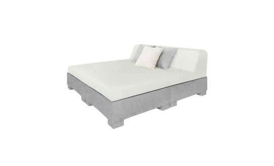 The Affinity Square Sunbed with Backrest Cushion by Ledge Lounger boasts a modern design featuring light gray upholstery, a simple headboard, and two pillows (white and gray). Ideal for elegant indoor use or poolside relaxation, this versatile sunbed effortlessly complements any setting.