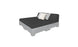 The Affinity Square Sunbed with Backrest Cushion by Ledge Lounger boasts a minimalist design with a gray mattress on a pallet-style base. It features black, white, and gray cushions against the backrest, perfect for poolside lounging or adding simple elegance to outdoor spaces.