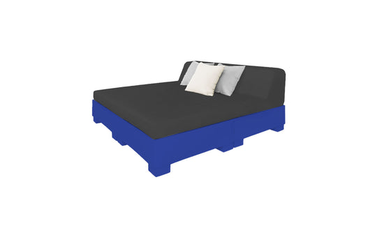The Affinity Square Sunbed with Backrest Cushion by Ledge Lounger features a black mattress, a white pillow, and a gray pillow on a blue pallet-style base. Ideal for poolside relaxation, it brings indoor comfort outdoors against a plain white backdrop.