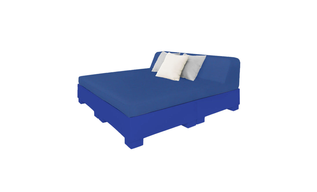 The Affinity Square Sunbed with Backrest Cushion by Ledge Lounger is perfect for poolside relaxing. It comes in blue with two white and one gray pillow, featuring a minimalist design that complements any outdoor space against a plain white background.