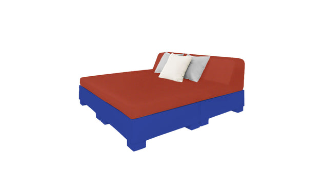 The Affinity Square Sunbed with Backrest Cushion from Ledge Lounger features a red mattress, two plush pillows—one white and one gray—on a blue base. Perfectly angled to stand out against a white backdrop, its an ideal poolside addition for relaxing.