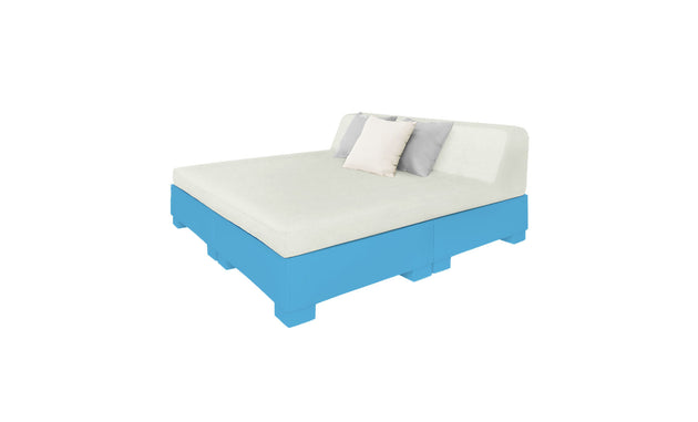 The Affinity Square Sunbed with Backrest Cushion by Ledge Lounger flaunts a minimalist design with a white mattress, dual pillows—white and gray—on a light blue platform with a slanted backrest. Ideal for poolside lounging, it offers tranquility against its simple white backdrop.