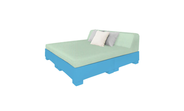 Experience the Affinity Square Sunbed with Backrest Cushion by Ledge Lounger, featuring a light green mattress and pillows on a bright blue platform. This setup offers a poolside relaxing vibe, ideal for any outdoor space or serene setting against a white backdrop.