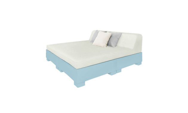 The Affinity Square Sunbed with Backrest Cushion by Ledge Lounger, featuring a light blue wooden frame, white mattress, soft backrest, two white pillows, and one gray pillow against a plain white backdrop, creates the perfect poolside ambiance.