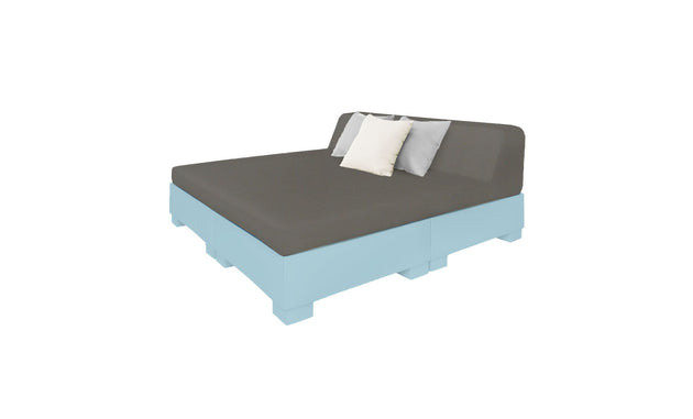 The Ledge Lounger Affinity Square Sunbed with Backrest Cushion boasts a modern light blue frame, dark gray mattress, and three white and gray pillows. Ideal for poolside relaxation, its displayed angled against a plain white backdrop.