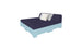 The Affinity Square Sunbed with Backrest Cushion by Ledge Lounger features a dark blue mattress and two pillows, one white and one grey, on a light blue frame and headboard. This setup is perfect for poolside relaxing, bringing indoor cozy comfort to your outdoor space against a white background.