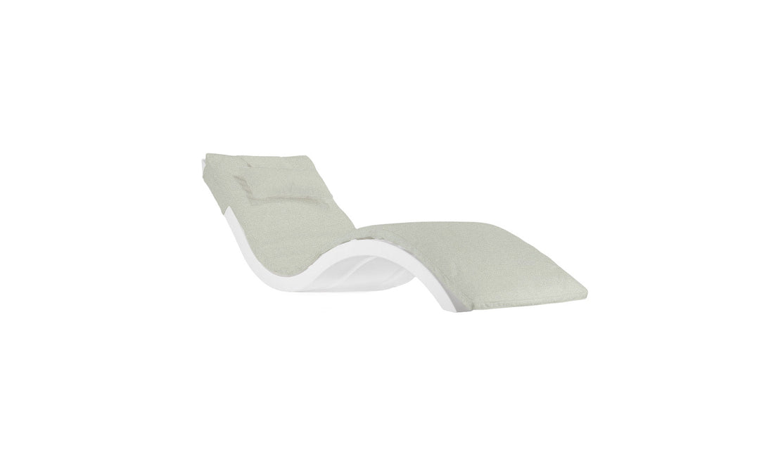 The Signature Chaise Cushion by Ledge Lounger is a modern lounge chair with a sleek, curved design. It features a light green cushioned seat and backrest for style and comfort, set against a plain white background. Final sale item.