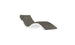 A sleek, modern lounge chair from Ledge Lounger’s Signature Chaise Cushion collection with a curvy white frame and dark grey cushion, featuring a wave-like design complemented by a headrest pillow on a plain white background.