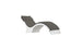 The Signature Chaise Deep Cushion by Ledge Lounger is a modern curved lounge chair with a white base and dark gray cushioning, featuring an arching seat and attached headrest for sleek comfort.