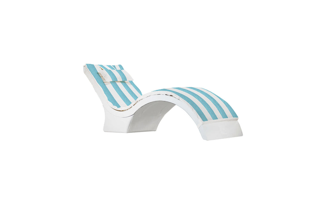 The Ledge Lounger Signature Chaise Cushion is a sleek, modern, white wavy design featuring a blue and white striped cushion with headrest pillow, perfect for outdoor or poolside relaxation.