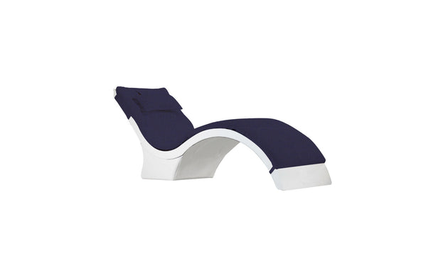 The Signature Chaise Deep Cushion by Ledge Lounger features a sleek, minimalist curved design in white and navy blue with an attached headrest pillow, set against a white backdrop. Final Sale.