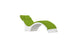 The Ledge Lounger Signature Chaise Cushion features a modern, curved design with a white base and green cushioning, complete with an integrated headrest pillow, set against a white background.
