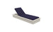 The Echo Chaise by Ledge Lounger features adjustable navy blue cushions elegantly reclined against a white background, ideal for enhancing any outdoor space.