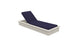 The Echo Chaise by Ledge Lounger features adjustable navy blue cushions elegantly reclined against a white background, ideal for enhancing any outdoor space.
