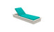 The Echo Chaise by Ledge Lounger offers a beige lounger with a teal cushion, perfect for outdoor spaces. Its adjustable backrest is shown partially reclined and boasts a simple, sleek frame design.