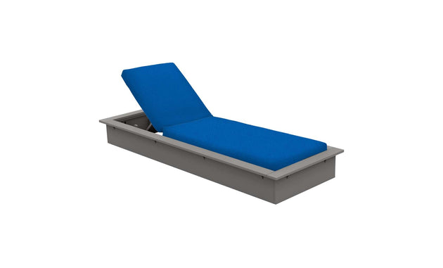 The Echo Chaise by Ledge Lounger is a gray adjustable lounger with a vibrant blue cushion and backrest, designed for comfort. Its modern, sleek design enhances any outdoor space or poolside relaxation area.