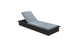 The Echo Chaise by Ledge Lounger is a modern lounger with light gray cushions on a black base, angled slightly upward. Its simple and minimalistic design enhances any outdoor space, perfect for a patio or garden setting.
