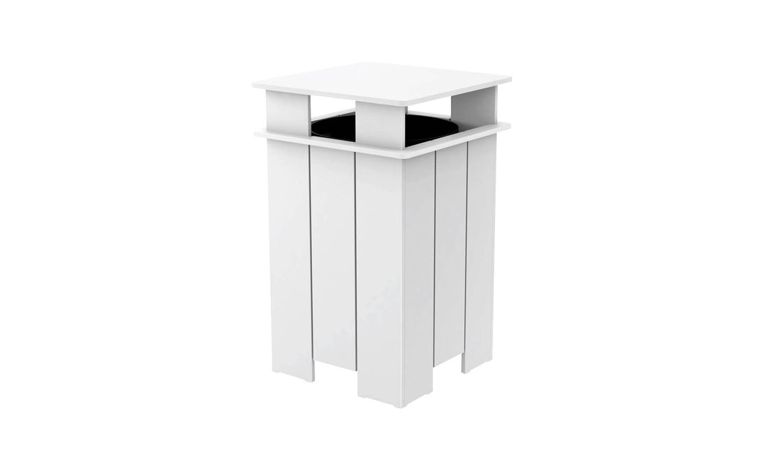 The Mainstay Trash Bin by Ledge Lounger is a tall, white, boxy planter with vertical slats and a flat top featuring a black inner pot. Ideal for indoor or outdoor use, it boasts UV-stable materials and clean lines for a modern aesthetic.