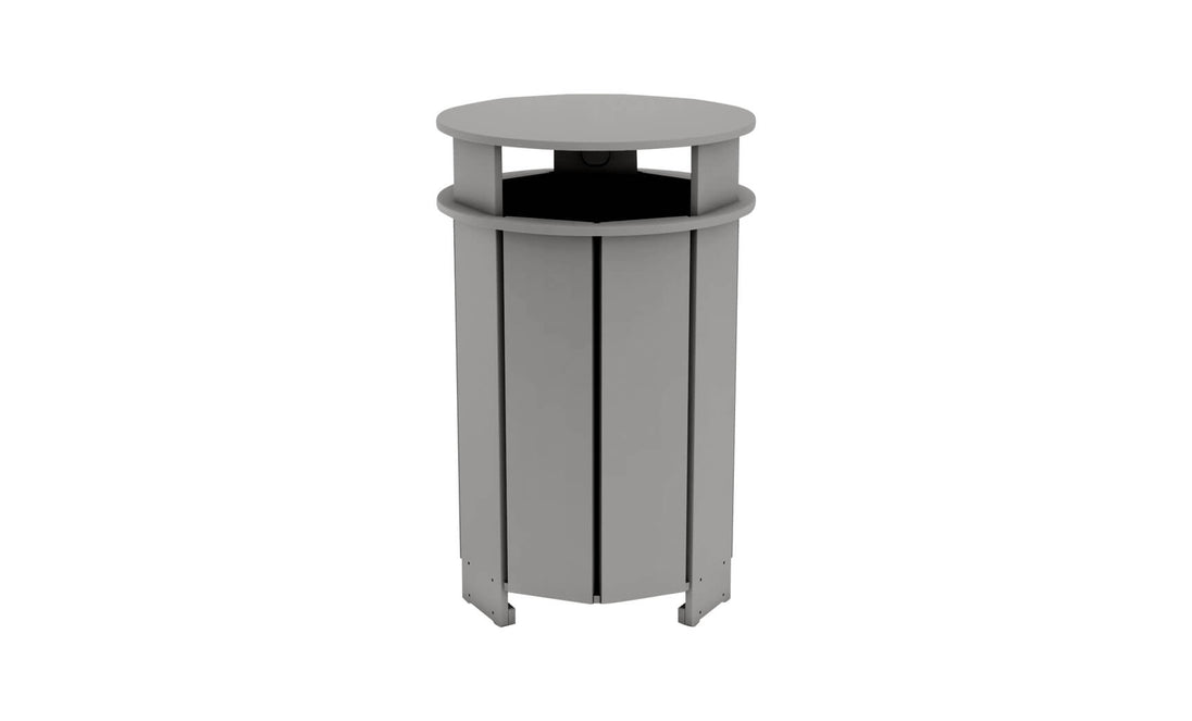 The Ledge Lounger Mainstay Trash Bin is a gray, cylindrical patio trash can with a slatted design and a slightly overhanging round lid. Made from UV stable materials, it stands on four feet to elevate it from the ground for optimal outdoor use.
