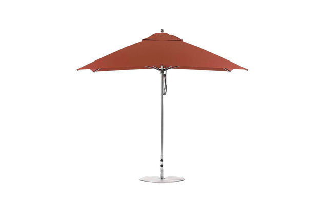 The Essential Fiberglass Umbrella - 10 Square Pulley by Ledge Lounger is shown open and upright against a white background. With its large red canopy, silver metal pole, sturdy base, marine-grade fabrics for durability, and vented top for airflow, its perfect for any patio setting.