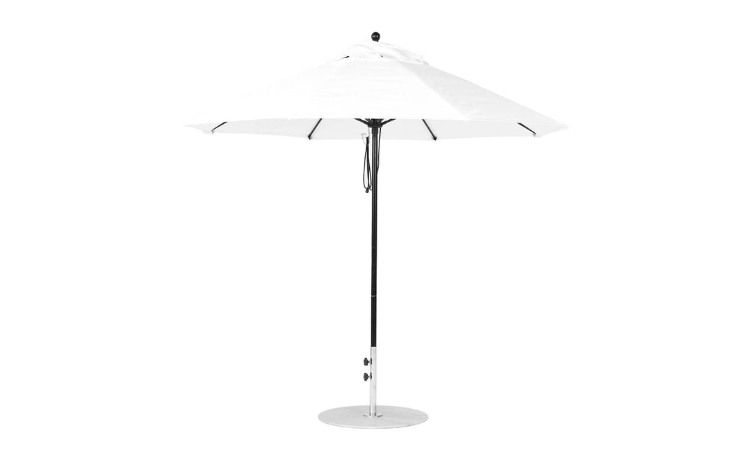 The Essential Fiberglass Umbrella - 9 Octagon Pulley from Ledge Lounger features a sleek silver pole, a rounded base, and marine-grade fabrics. It offers a classic octagonal shape for outdoor use, blending simple and modern design for reliable shade.
