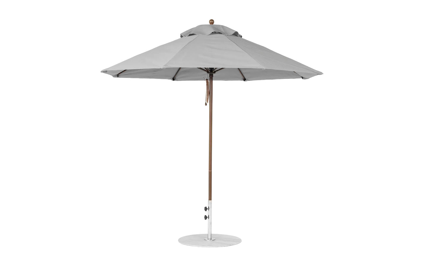 A 9 octagon Essential Fiberglass Umbrella by Ledge Lounger, featuring a large grey canopy of marine-grade fabric, fully opened with a wooden pole and circular metallic base for stability, perfect for outdoor shading.