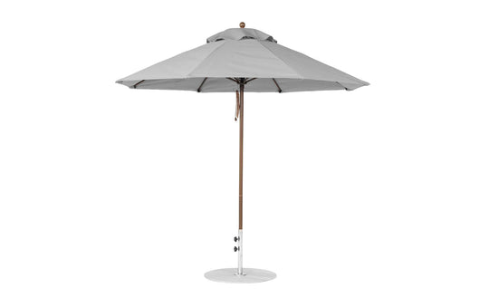 A 9 octagon Essential Fiberglass Umbrella by Ledge Lounger, featuring a large grey canopy of marine-grade fabric, fully opened with a wooden pole and circular metallic base for stability, perfect for outdoor shading.