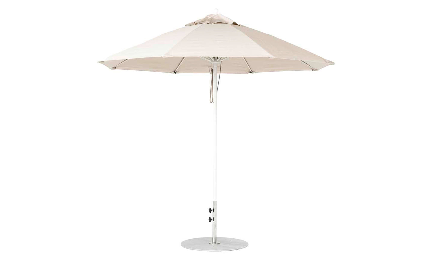 A 9 Octagon Pulley Essential Fiberglass Umbrella by Ledge Lounger stands upright on a round metal base. Its beige, marine-grade fabric canopy is supported by sturdy metal ribs, ensuring durability against the elements.